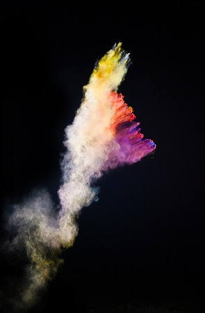 Launched colorful powder, isolated on black background