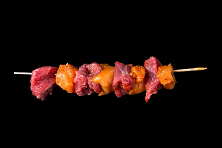 Tasty skewers on black background, close-up の写真素材