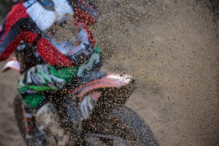 Motocross bike in a race, close-up の写真素材