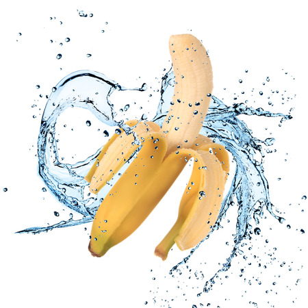 Banana with water splash isolated on whiteの写真素材