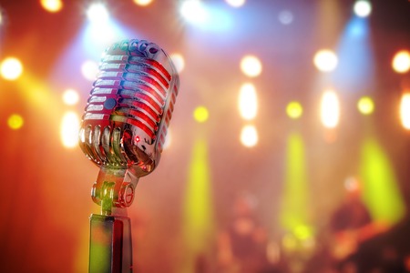 Retro microphone against colourful backgroundの写真素材