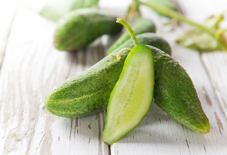 Fresh cucumbers on wooden table, close-up.の写真素材