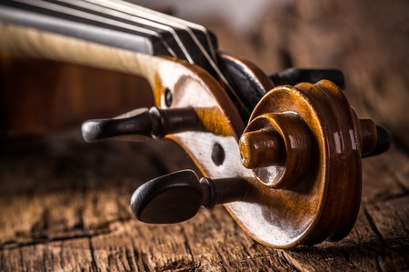 violin in vintage style on wood backgroundの写真素材