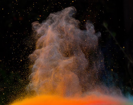 Launched colorful powder, isolated on black backgroundの写真素材