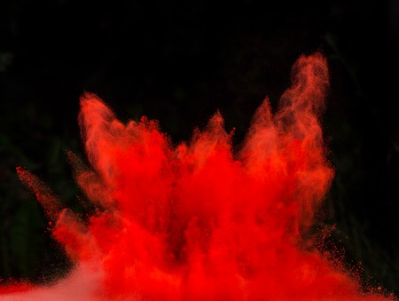 Launched colorful powder, isolated on black backgroundの写真素材