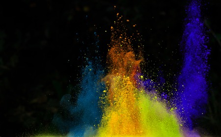 Launched colorful powder, isolated on black backgroundの写真素材