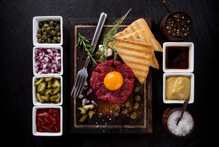 fresh beef tartar with egg, close-up.の写真素材