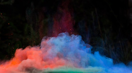 Launched colorful powder, isolated on black backgroundの写真素材