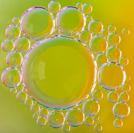 Oil soils on water surface, close-up.
