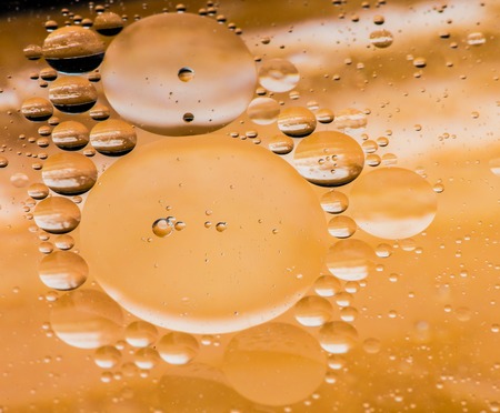 Abstract shapes in colored water, close-up.の写真素材