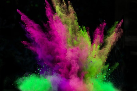 Colorful powder in freeze motion isolated on black background