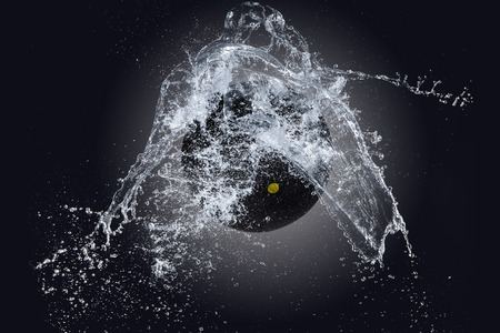 Sport ball with water splashの写真素材