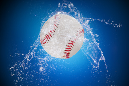 Sport ball with water splashの写真素材