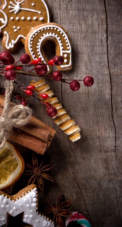 Traditional gingerbread cookies over wooden backgroundの写真素材