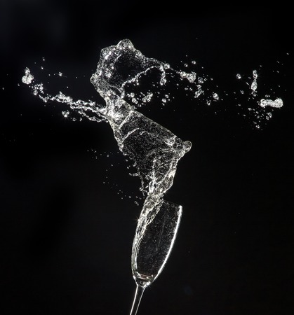 Champagne glasses isolated on black backgroundの写真素材