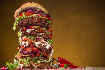 Delicious big hamburger on wooden backgroundの写真素材