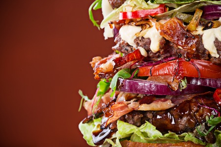 Delicious big hamburger on wooden backgroundの写真素材