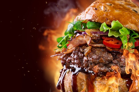 Delicious hamburger on wooden backgroundの写真素材