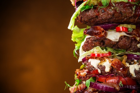 Delicious big hamburger on wooden backgroundの写真素材