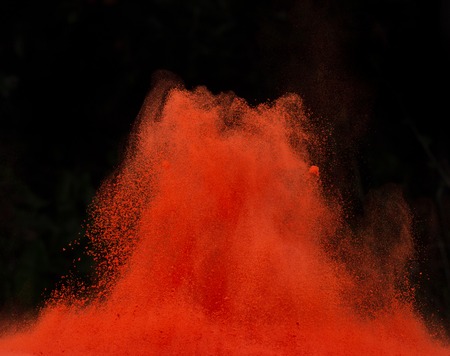 Launched colorful powder, isolated on black backgroundの写真素材