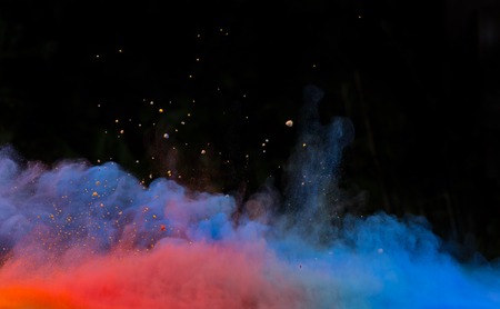 Launched colorful powder, isolated on black backgroundの写真素材