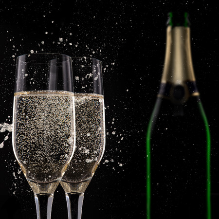Champagne flutes on black , celebration theme.の写真素材