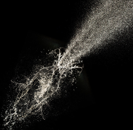 Abstract champagne bottle on black background, celebration theme.