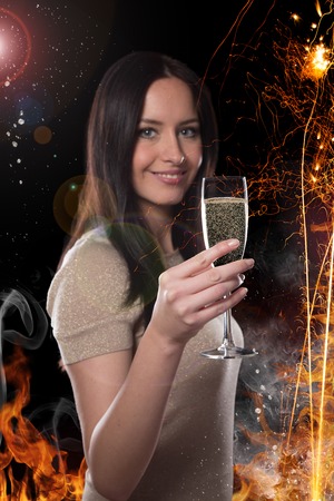 Young brunette woman with champagne glass, celebration theme.の写真素材