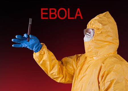 Scientist with protective yellow hazmat suit, ebola concept.
