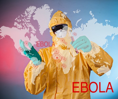 Scientist with protective yellow hazmat suit, ebola concept.の写真素材