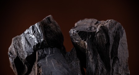 Coal lumps on dark background, close-upの写真素材