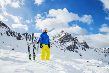 Skier in high mountains during sunny day.の写真素材