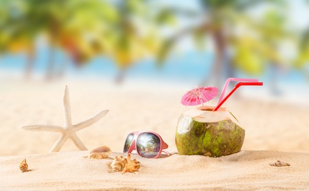 summer coconut cocktail on tropical beach.の写真素材