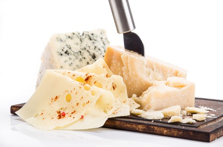 Various types of cheese on white background