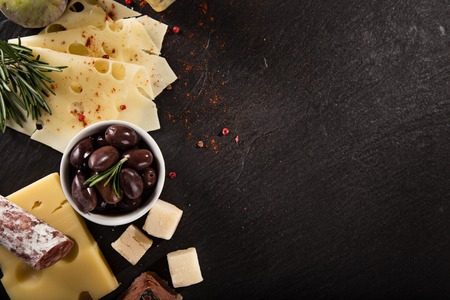 Various types of cheese on stone table, still-life.の写真素材