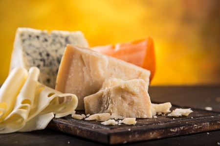 Parmigiano reggiano on wooden background, close-up.の写真素材