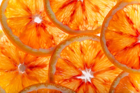 Sliced fruits background, orange close-up.の写真素材