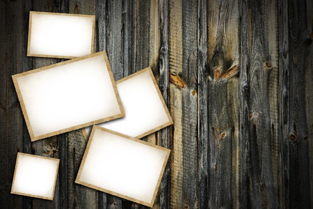 Vintage blank photo frames on wooden backgroundの写真素材
