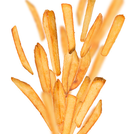 French fries in freeze motion isolated on whiteの写真素材