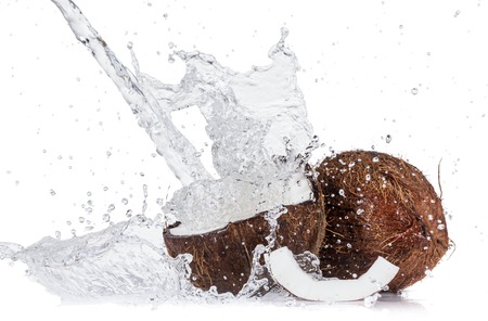 Cracked coconuts on white background, close-up.の写真素材