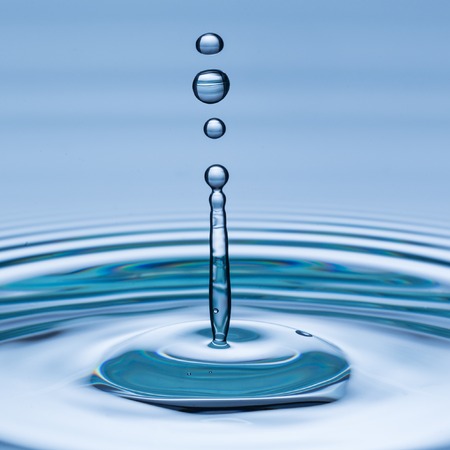 Water drop in freeze motion, macro shot.の写真素材