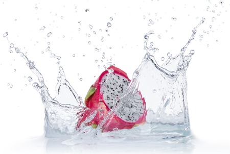 Dragon fruit in water splash isolated on white backgroundの写真素材