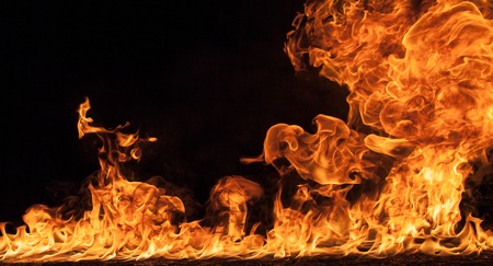 Fire flames on black background backgroundの写真素材