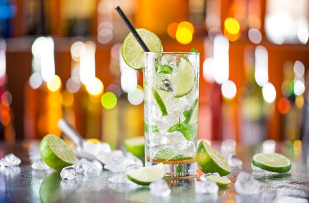 fresh mojito drink on bar desk, close-up.の写真素材