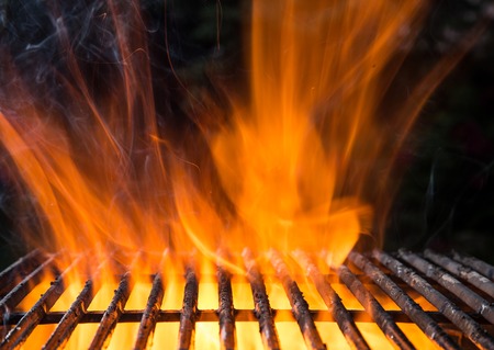 Cast-iron grate with fire flamesの写真素材