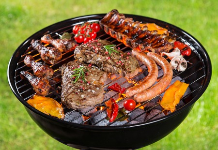 Delicious meats on garden grillの写真素材