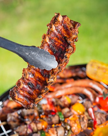 Delicious pork spareribs on grill grateの写真素材
