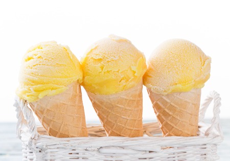 Ice cream scoops on wooden table, close-up.の写真素材