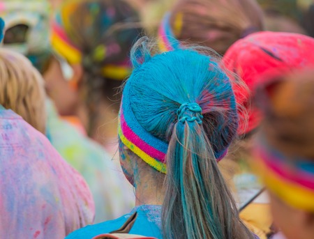 Close-up of marathon, people covered with colored powder.の写真素材