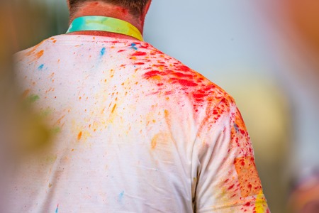 Close-up of marathon, people covered with colored powder.の写真素材